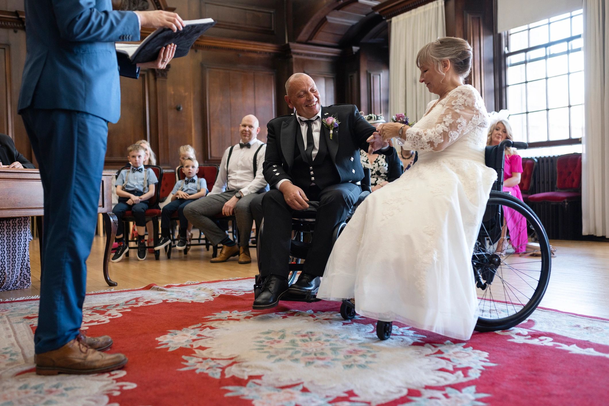Wedding ceremony ring exchange with couple