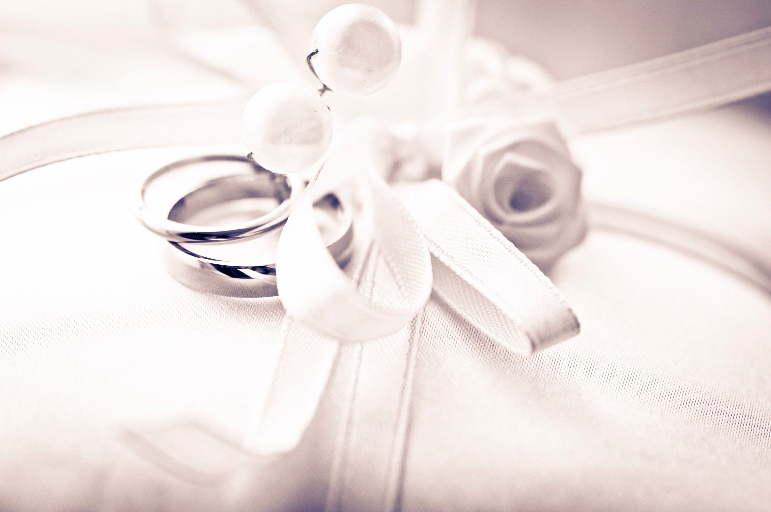 Wedding rings on pillow detail shot