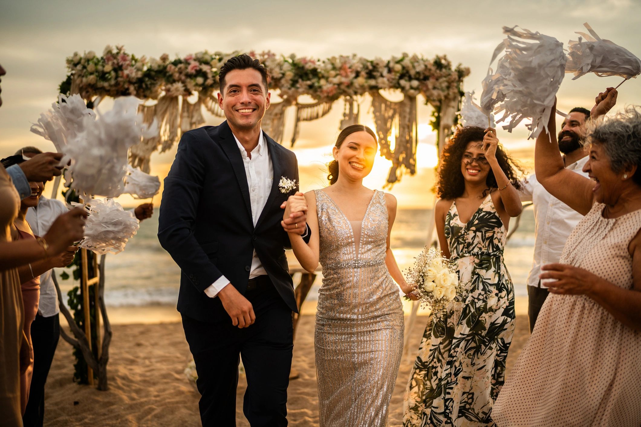Newlyweds celebrating with guests at wedding ceremony